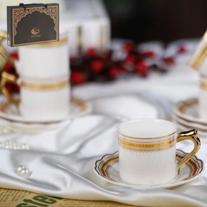 طقم فناجين قهوة بورسلان ابيض حز مع يد ونقش من الاعلى ذهبي 12 فنجان + 12 صحن شكل وردة طقم فناجين قهوة بورسلان ابيض حز مع يد ونقش من الاعلى ذهبي 12 فنجان + 12 صحن شكل وردة