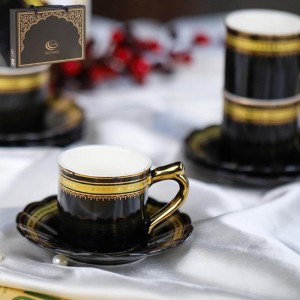 طقم فناجين قهوة بورسلان اسود حز مع يد ونقش من الاعلى ذهبي 12 فنجان + 12 صحن شكل وردة طقم فناجين قهوة بورسلان اسود حز مع يد ونقش من الاعلى ذهبي 12 فنجان + 12 صحن شكل وردة