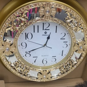 ساعه بلاستيك بيوتر مدور مذهب مع زجاج سترص 