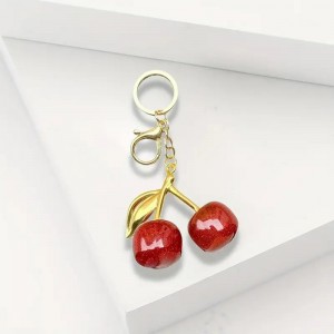   ميدالية شكل كرزتين لون احمر