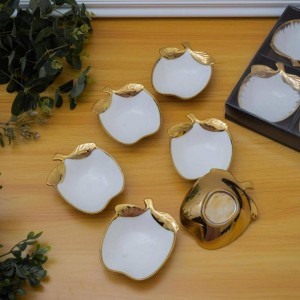 طقم/6صحون مكسرات بورسلان ابيض شكل تفاحة حيف ذهبي طقم/6صحون مكسرات بورسلان ابيض شكل تفاحة حيف ذهبي